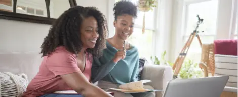Mother and daughter doing homework at home