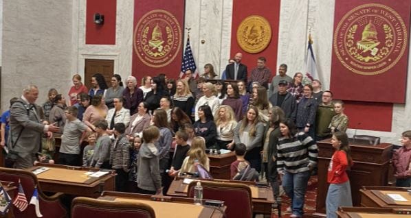 a crowd of WVVA students pose for a phoot at the WV capitol
