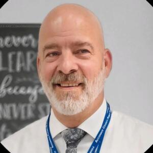 Smiling headshot of teacher James Conley