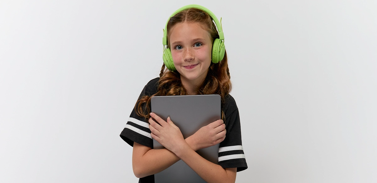 girl smiling with iPad in her hands